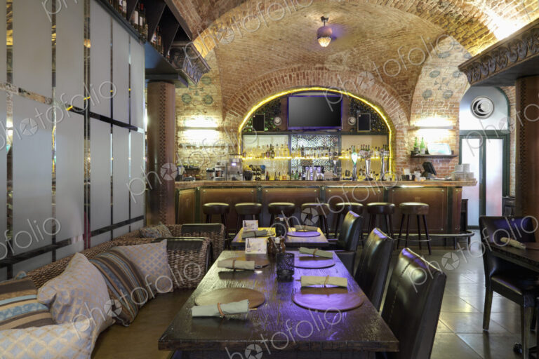 Restaurant interior with bar on background.