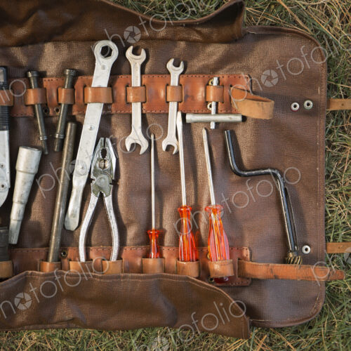 Retro Ferrari tool belt in grass Retro Ferrari tool belt in grass