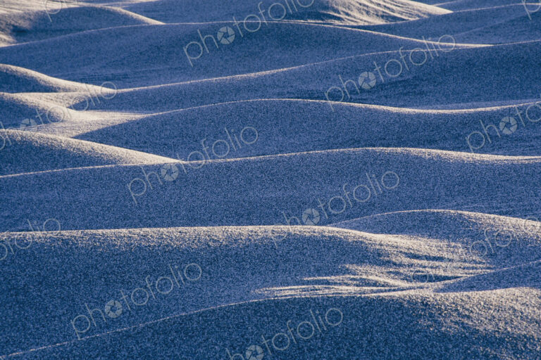 Ripples and patterns of sand dune at dawn.
