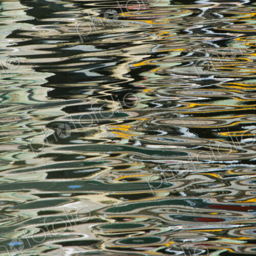 Ripples on the water surface in Juneau boat harbor. Alaska, USA Ripples on the water surface in Juneau boat harbor. Alaska, USA