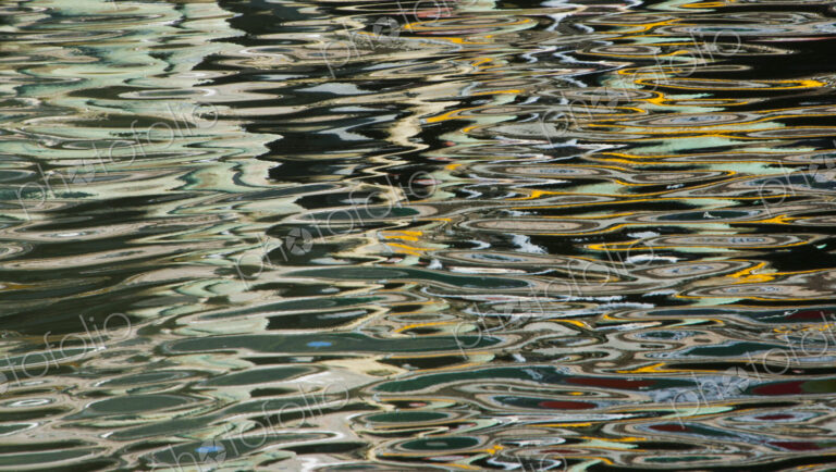 Ripples on the water surface in Juneau boat harbor. Alaska, USA