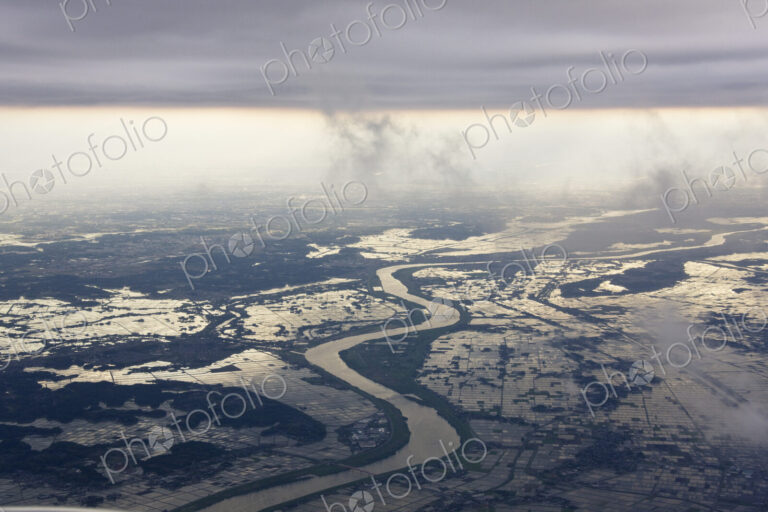River Running through a Flooded Countryside