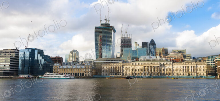 River Thames and the North Bank skyline, buildings of the City of London, a historic…