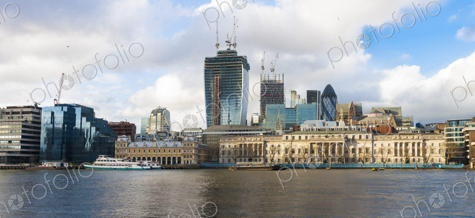 River Thames and the North Bank skyline, buildings of the City of London, a historic…