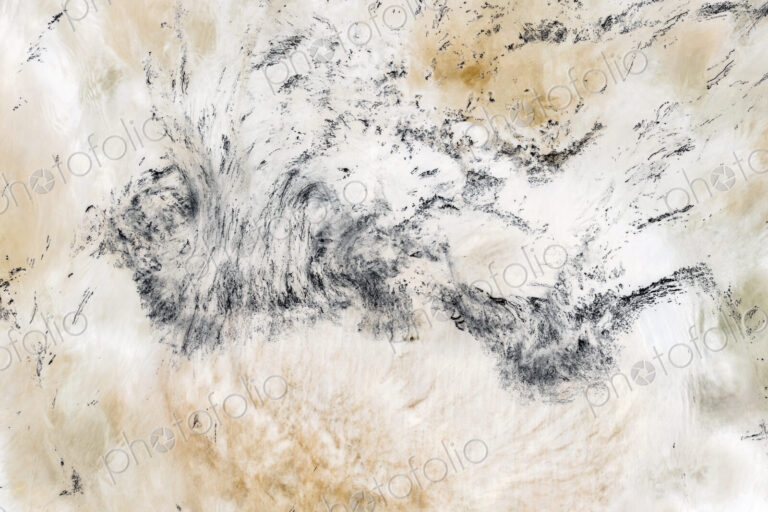 River water abstract, long exposure of river water flowing over boulders and rocks