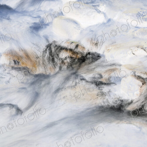 River water abstract, long exposure of river water flowing over boulders and rocks River water abstract, long exposure of river water flowing over boulders and rocks