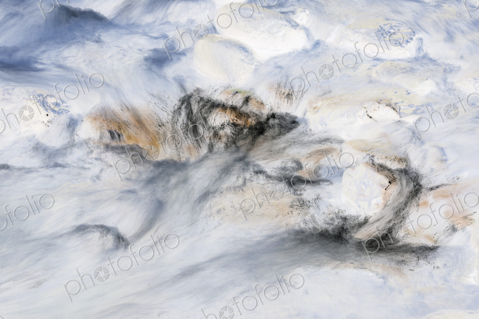 River water abstract, long exposure of river water flowing over boulders and rocks