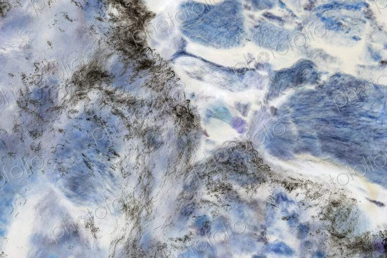 River water abstract, long exposure of river water flowing over boulders and rocks,…