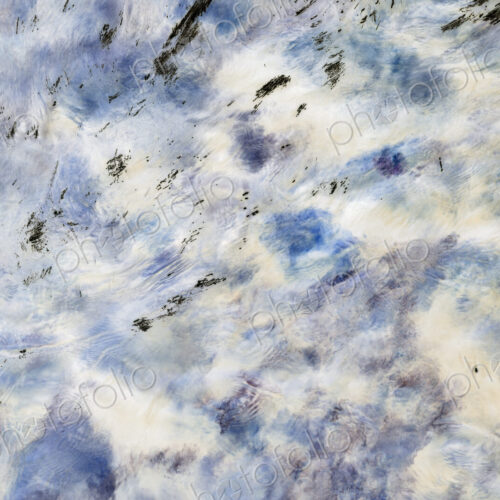 River water abstract, long exposure of river water flowing over boulders and rocks,…