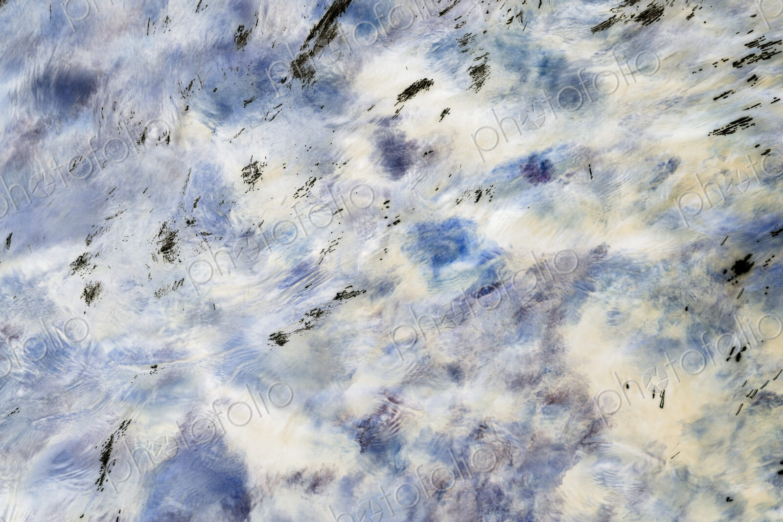 River water abstract, long exposure of river water flowing over boulders and rocks,…
