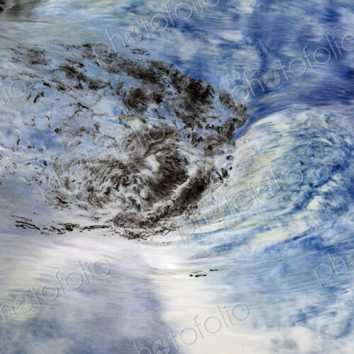 River water abstract, long exposure of river water flowing over boulders and rocks,…