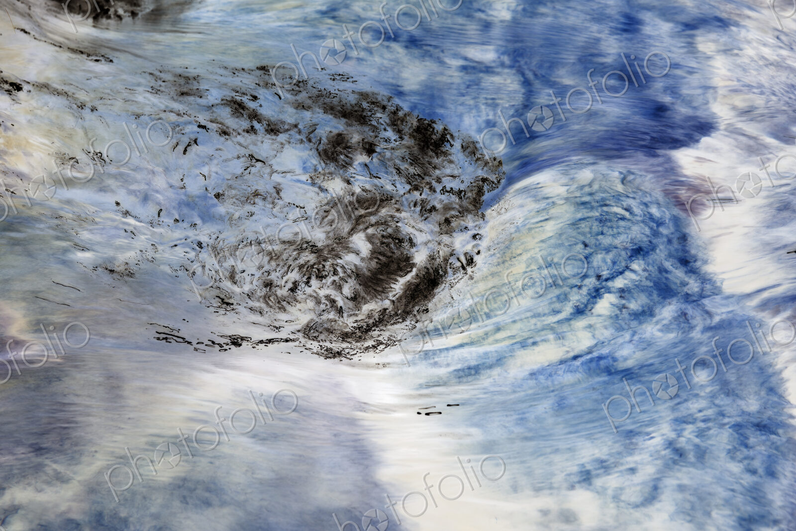 River water abstract, long exposure of river water flowing over boulders and rocks,…