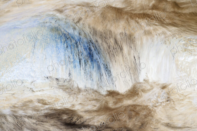 River water abstract, long exposure of river water flowing over boulders and rocks,…