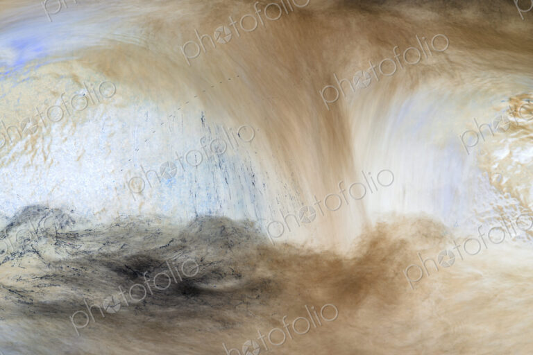 River water abstract, long exposure of river water flowing over boulders and rocks,…
