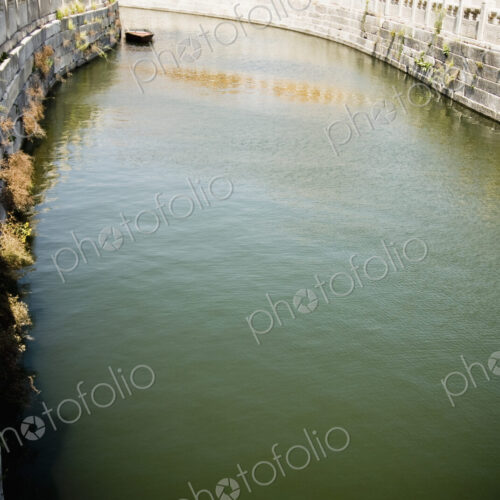 River with stone embankment. River with stone embankment.
