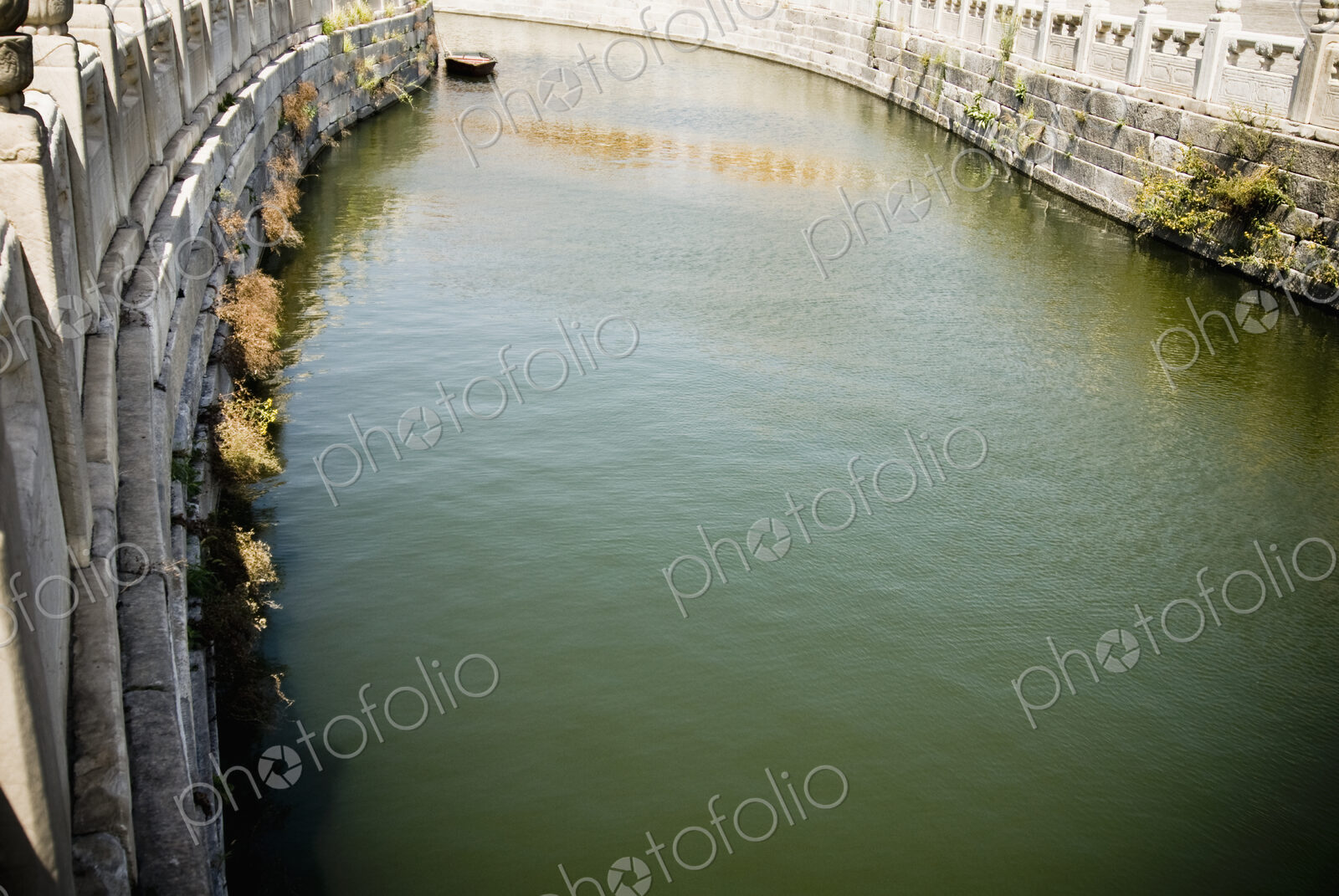 River with stone embankment.