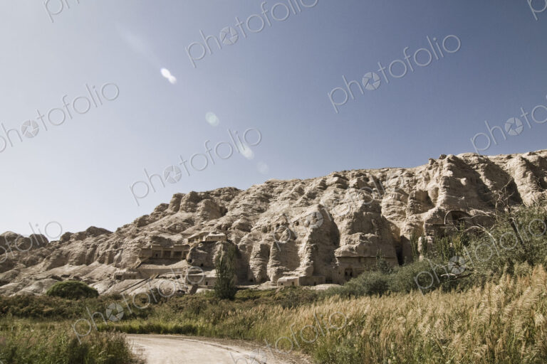 Road Amidst Rocky Landscape