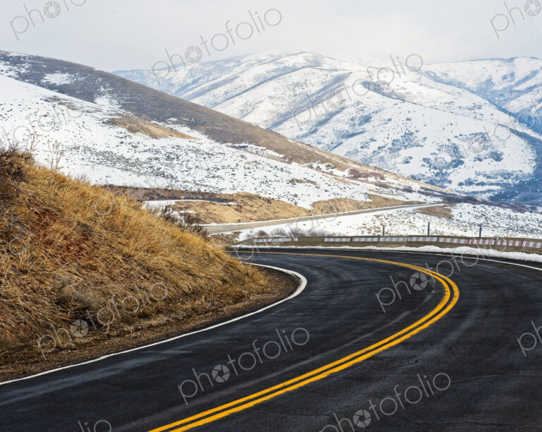 Road Through a Snowy Mountain Landscape