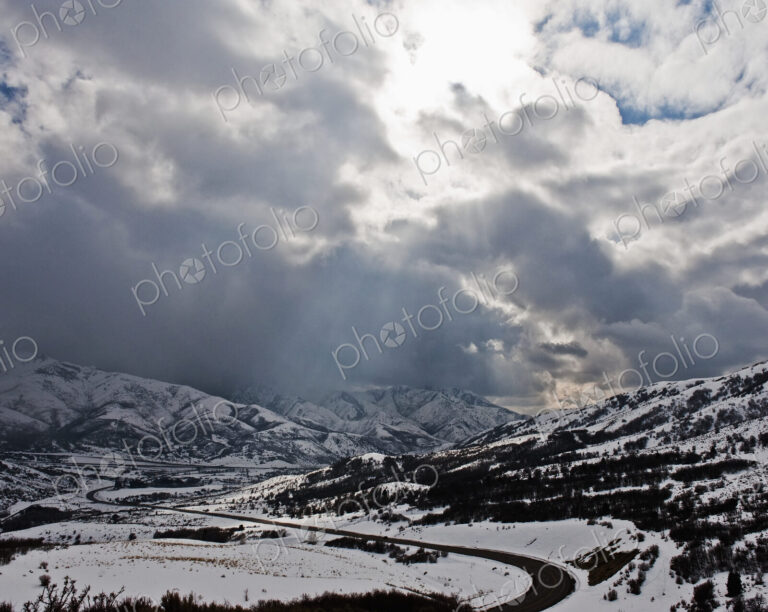Road Through a Snowy Mountain Landscape