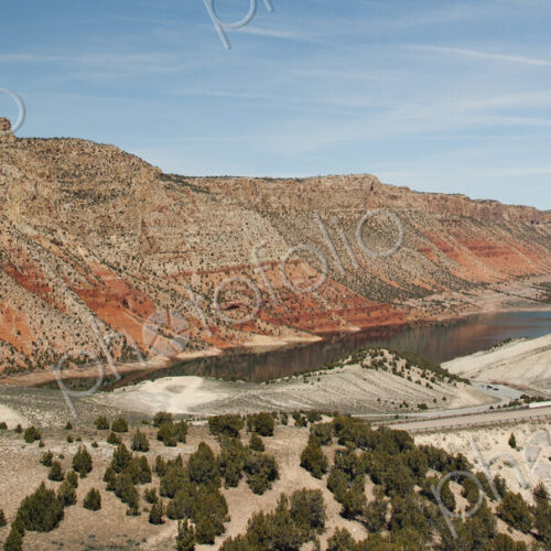 Road along lake and rock formations