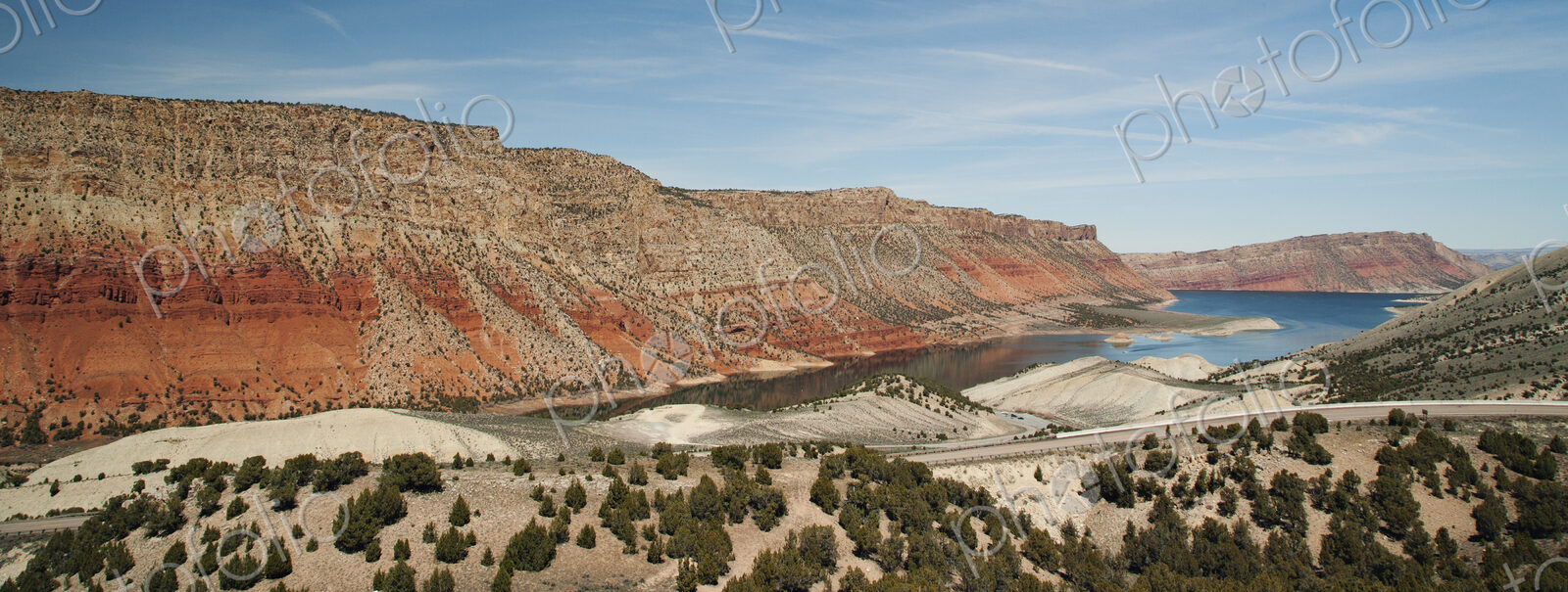 Road along lake and rock formations