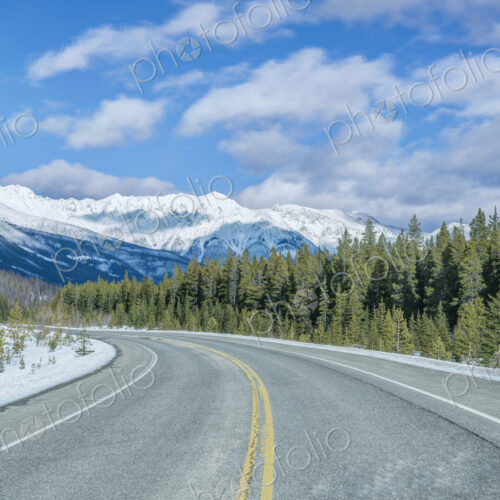 Road leading to snowy mountains Road leading to snowy mountains