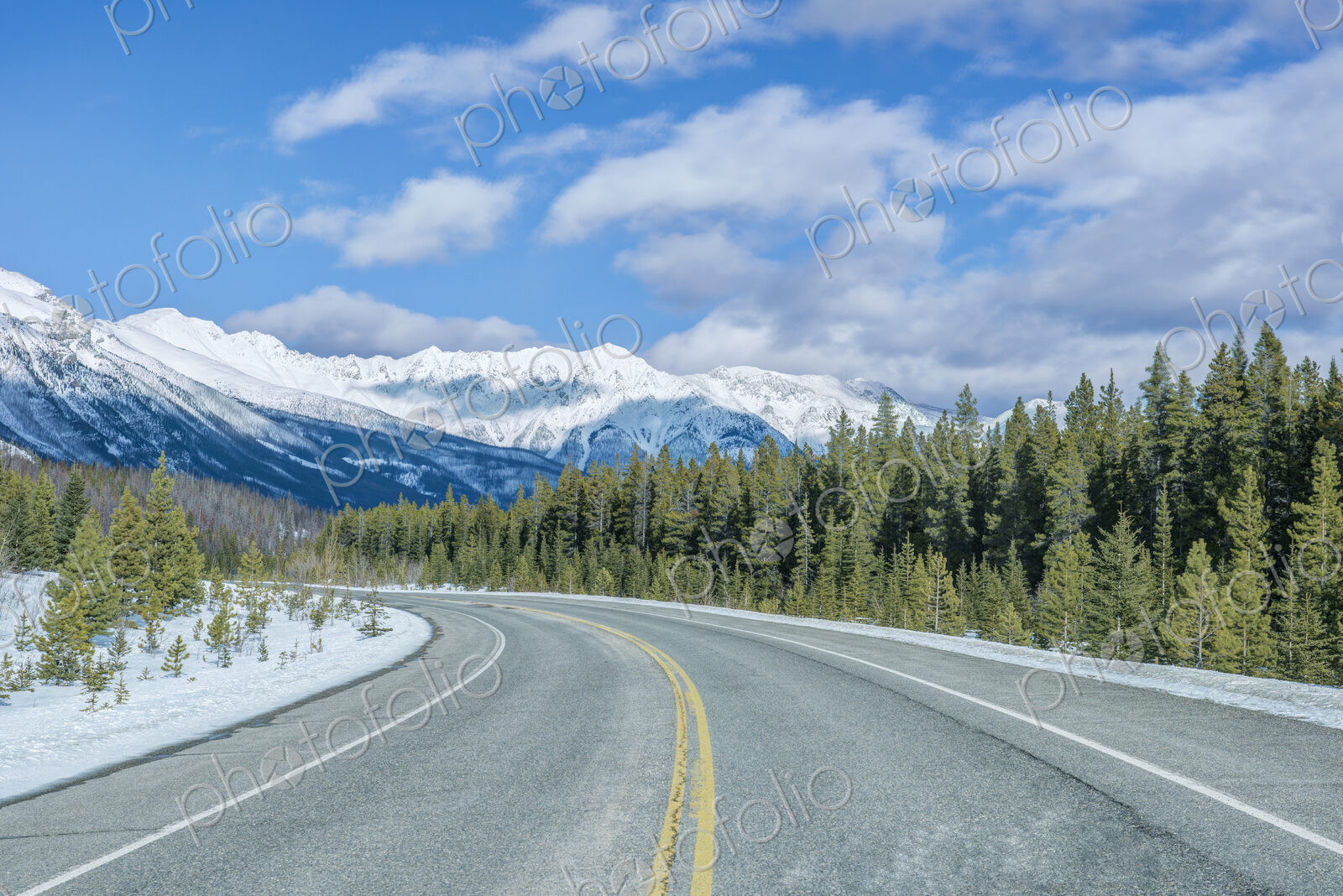 Road leading to snowy mountains