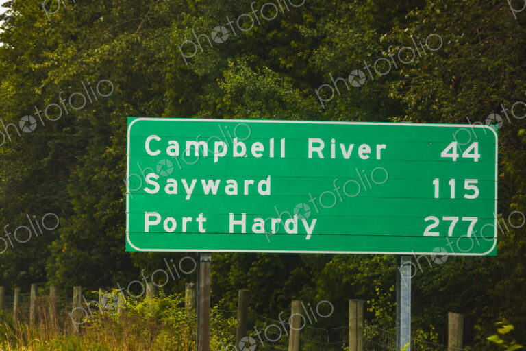 Road sign for Vancouver Island along Highway Highway 1, with mileage information