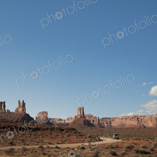 Rock formations along rural road, Valley of the Gods, Utah, United States Rock formations along rural road, Valley of the Gods, Utah, United States