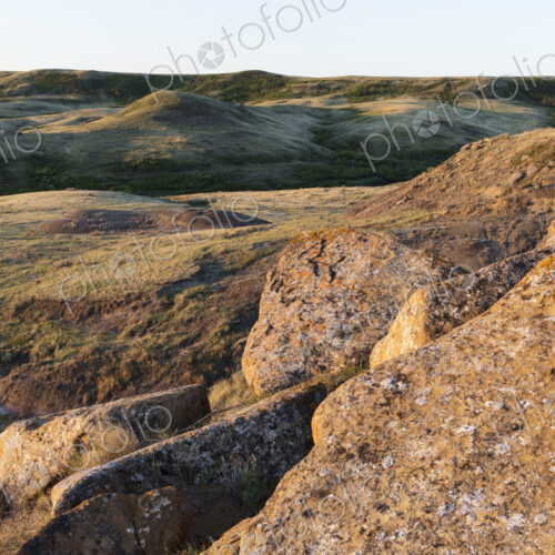 Rock formations and rolling hills at dusk, Grasslands National Park, Saskatchewan, Canada.