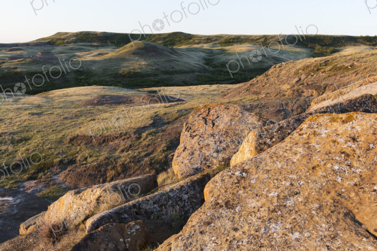 Rock formations and rolling hills at dusk, Grasslands National Park, Saskatchewan, Canada.