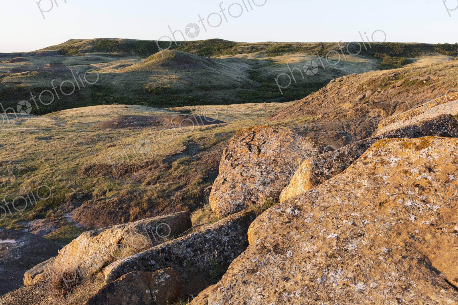 Rock formations and rolling hills at dusk, Grasslands National Park, Saskatchewan, Canada.