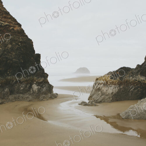 Rock formations on beach at low tide, Arcadia Beach State Park, Oregon Rock formations on beach at low tide, Arcadia Beach State Park, Oregon