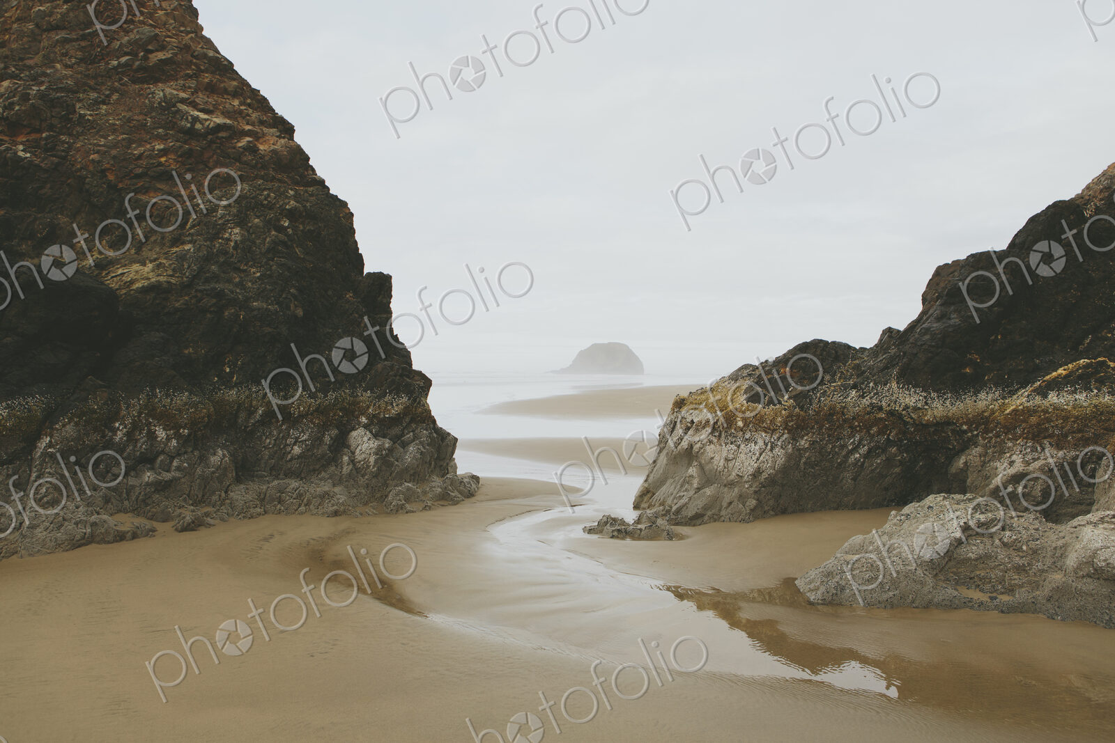Rock formations on beach at low tide, Arcadia Beach State Park, Oregon
