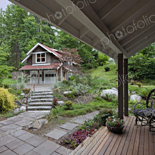 Rocking chair on porch overlooking garden Rocking chair on porch overlooking garden