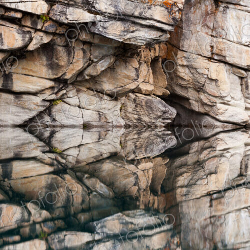 Rocky cliffs perfectly reflected in the calm waters of Horseshoe Lake, Jasper National… Rocky cliffs perfectly reflected in the calm waters of Horseshoe Lake, Jasper National…