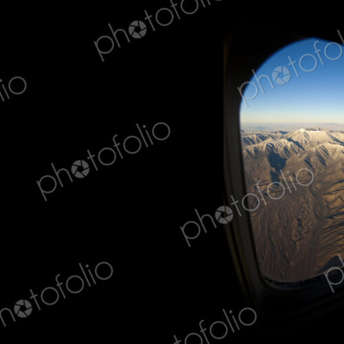 Rocky landscape viewed from airplane window