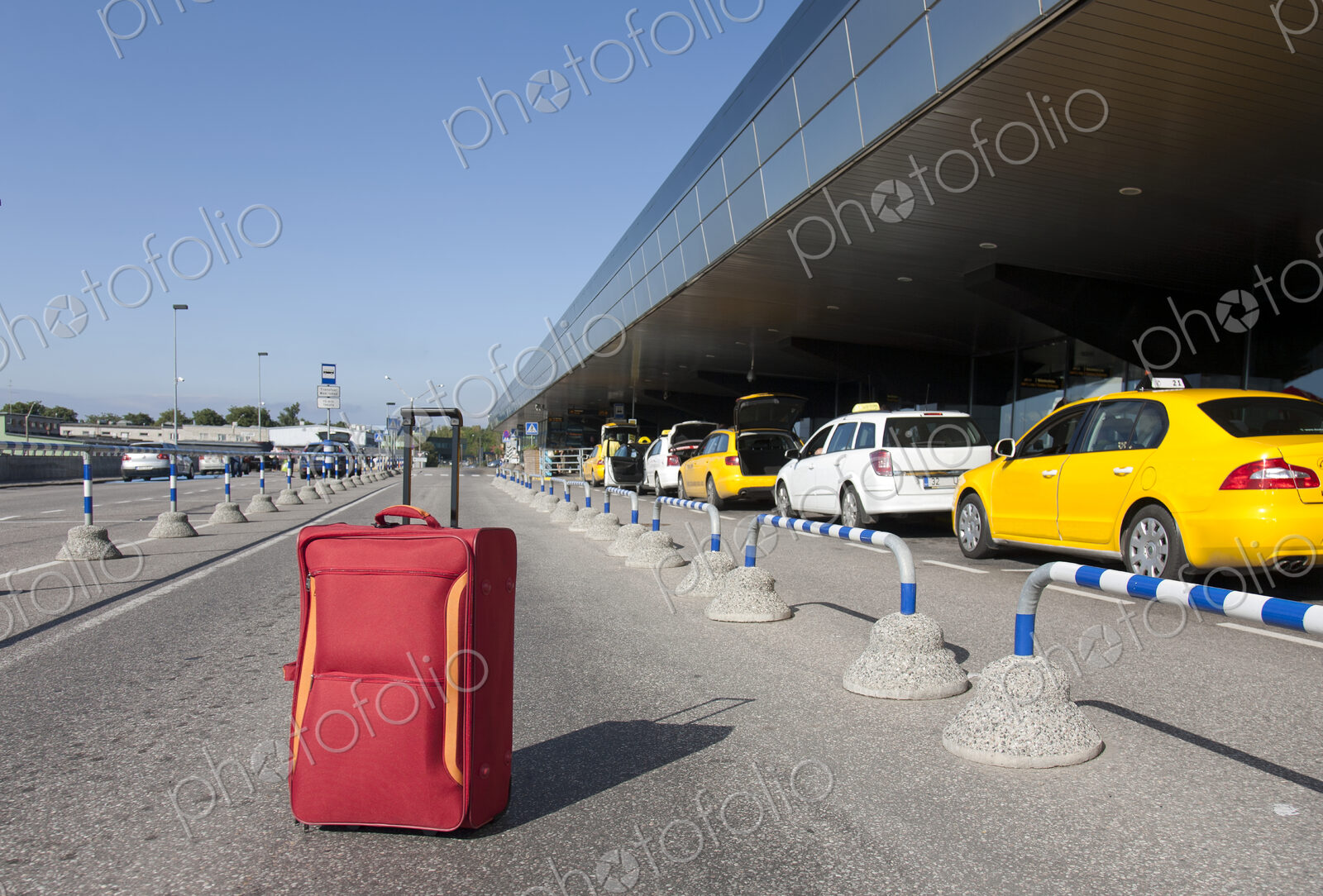 Rolling Luggage Outside an Airport Terminal