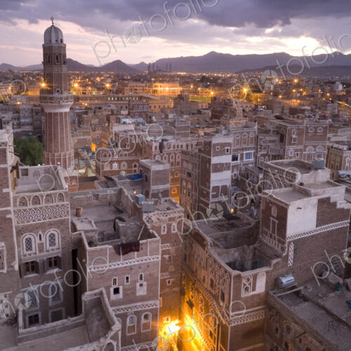 Rooftops of buildings in the old city of Sana'a in Yemen at dusk Rooftops of buildings in the old city of Sana'a in Yemen at dusk