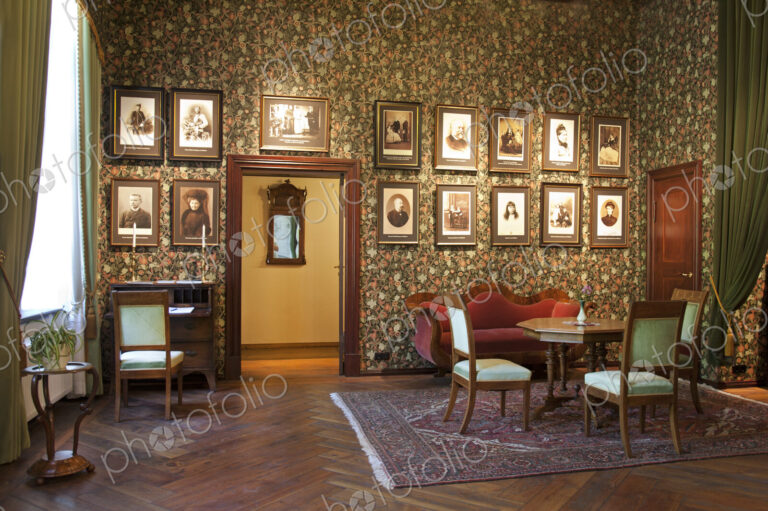 Room With Framed Portraits