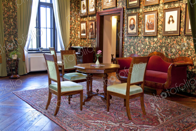 Room With Framed Portraits