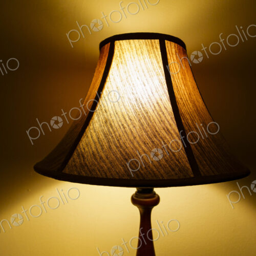 Room illuminated by a lamp lit at night, shadows on the wall. amp Room illuminated by a lamp lit at night, shadows on the wall. amp