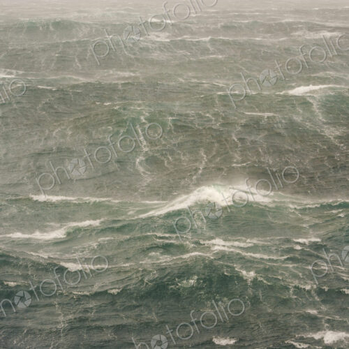 Rough seas near the South Georgia Island. Waves and spray on the water's surface. Rough seas near the South Georgia Island. Waves and spray on the water's surface.