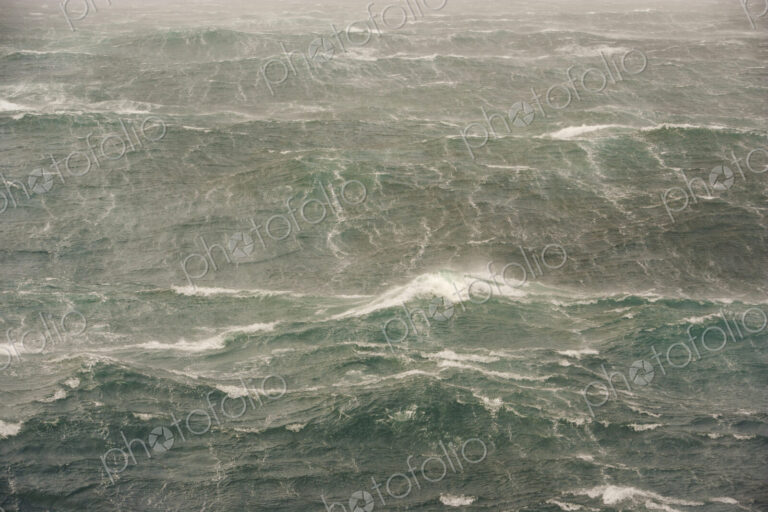 Rough seas near the South Georgia Island. Waves and spray on the water's surface.