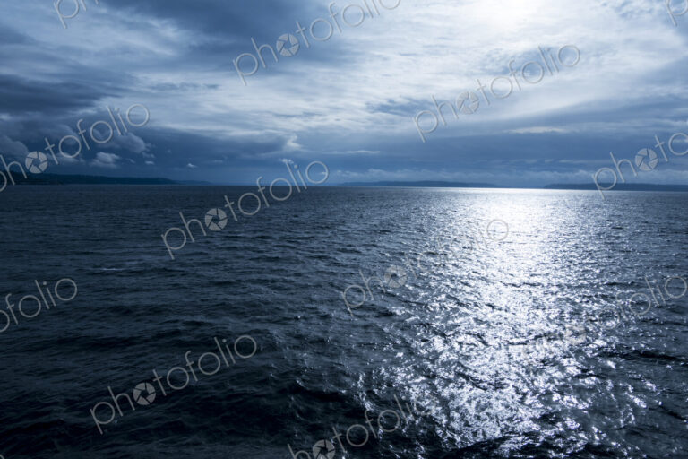 Rough water on Puget Sound, clouds in the sky.