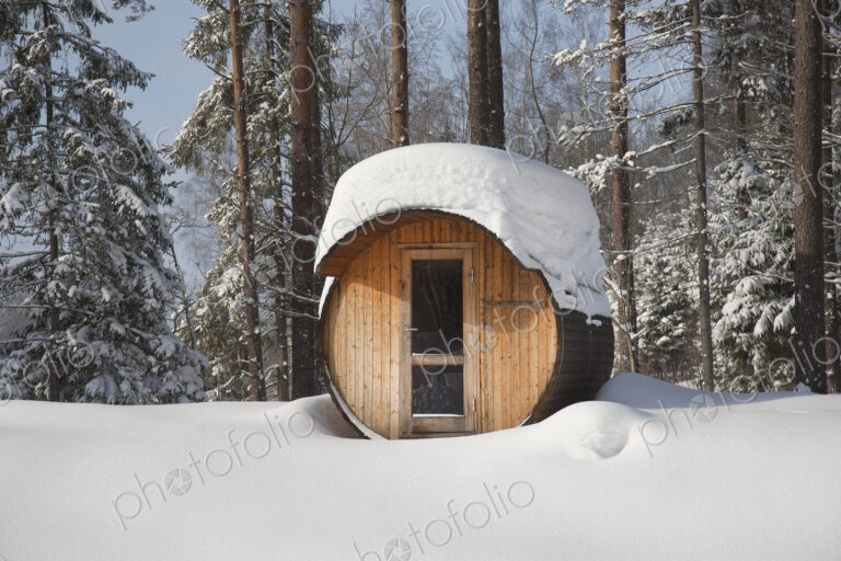 Round Barrel Sauna in the Snow