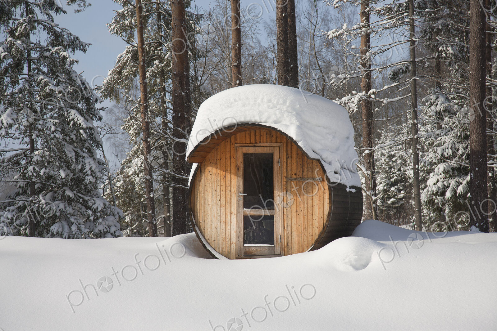 Round Barrel Sauna in the Snow
