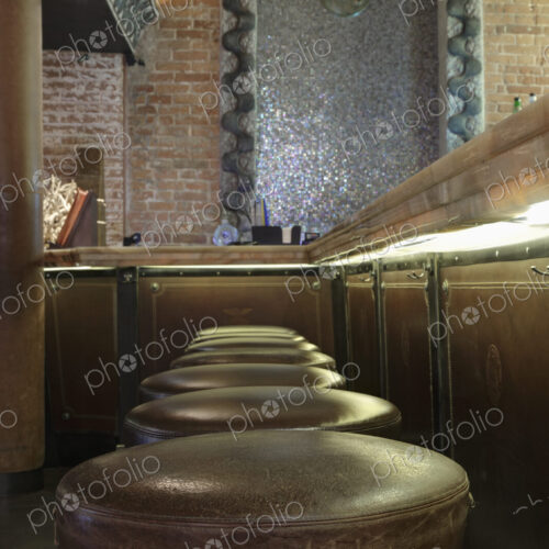 Row of leather seats in bar. Row of leather seats in bar.