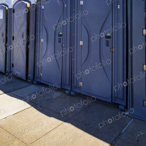 Row of portable restrooms at a reststop area on Route 90 in Washington state. Row of portable restrooms at a reststop area on Route 90 in Washington state.