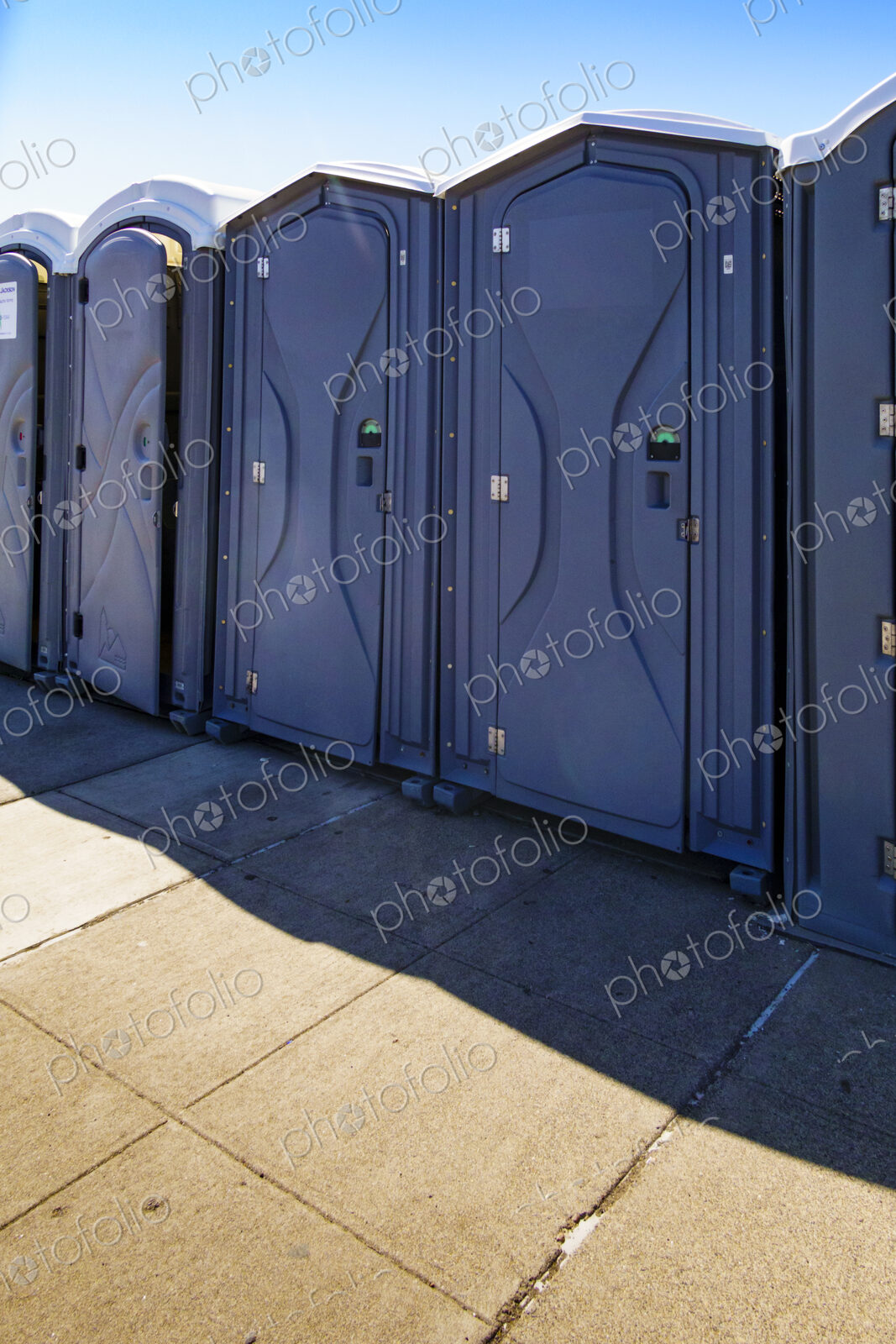 Row of portable restrooms at a reststop area on Route 90 in Washington state.